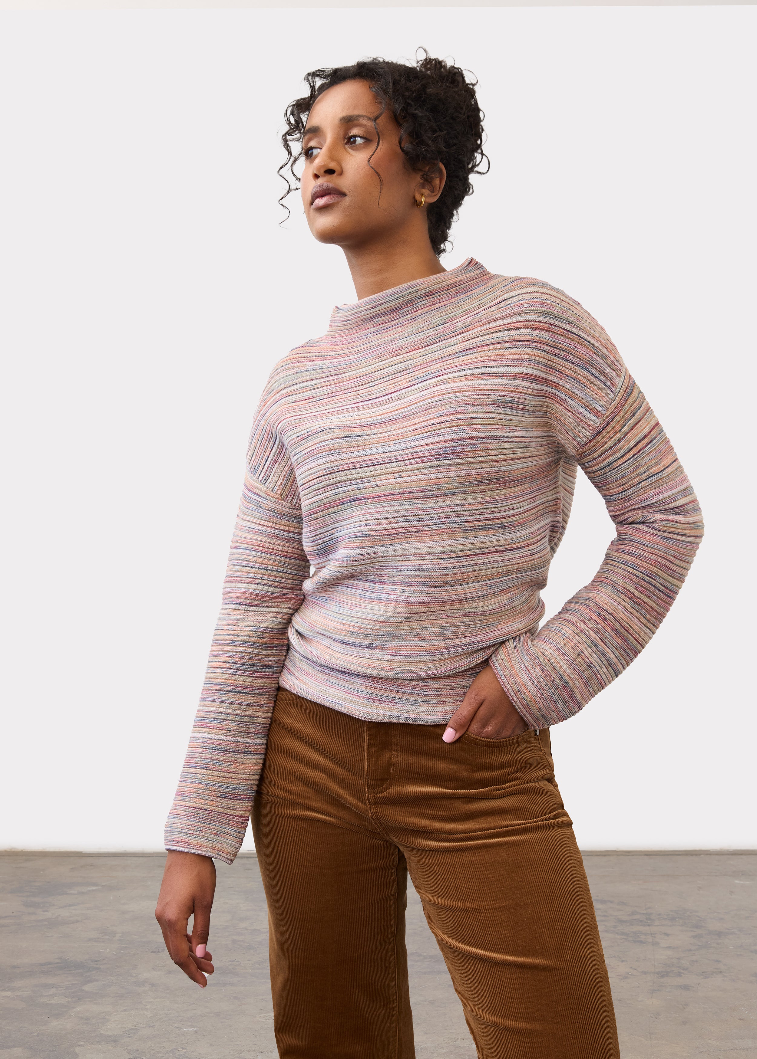 Front view of argyle patterned sweater in grey, blue, and red by French Dressing Jeans (FDJ)