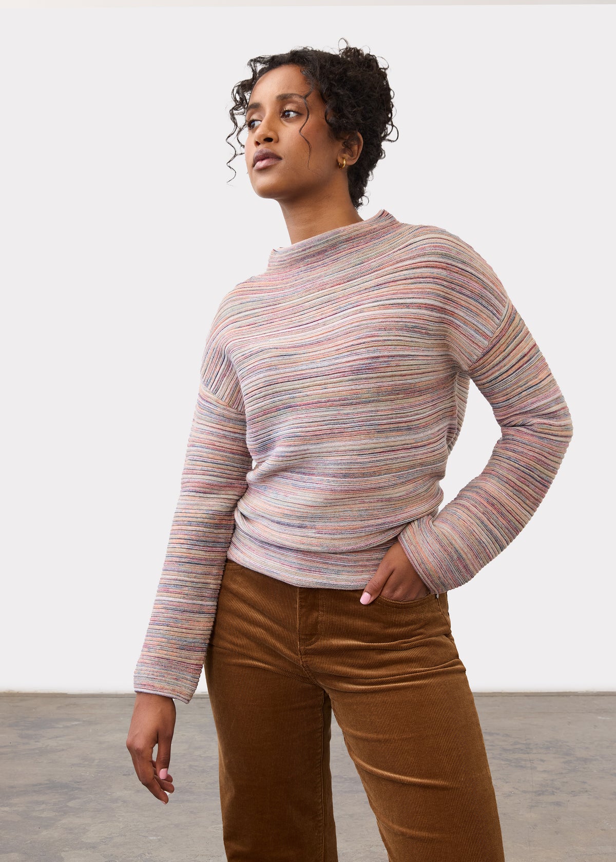 Front view of argyle patterned sweater in grey, blue, and red by French Dressing Jeans (FDJ)