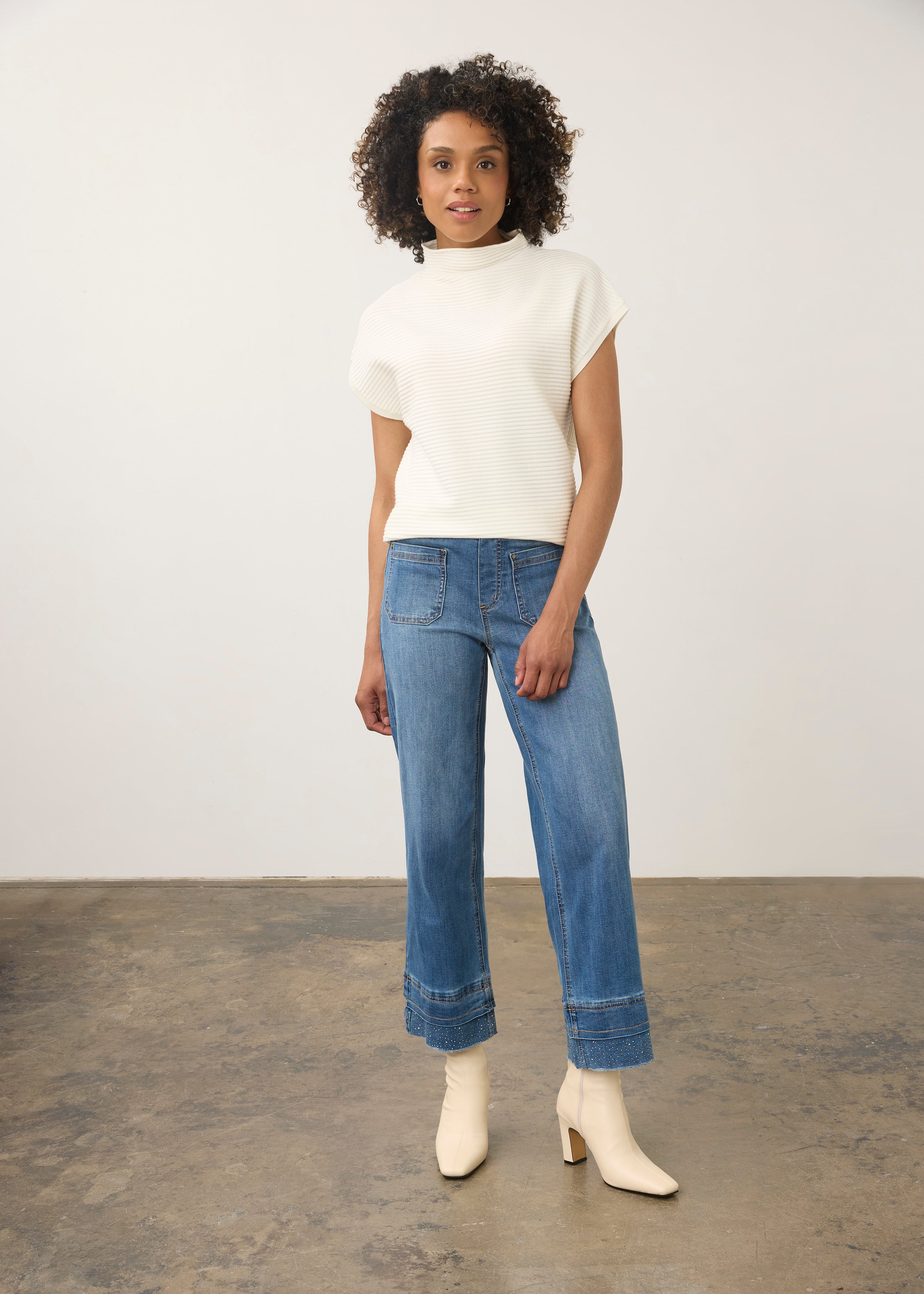 Model wearing medium blue wide ankle denim with mid-rise waist in full view by French Dressing Jeans (FDJ) par French Dressing Jeans (FDJ)
