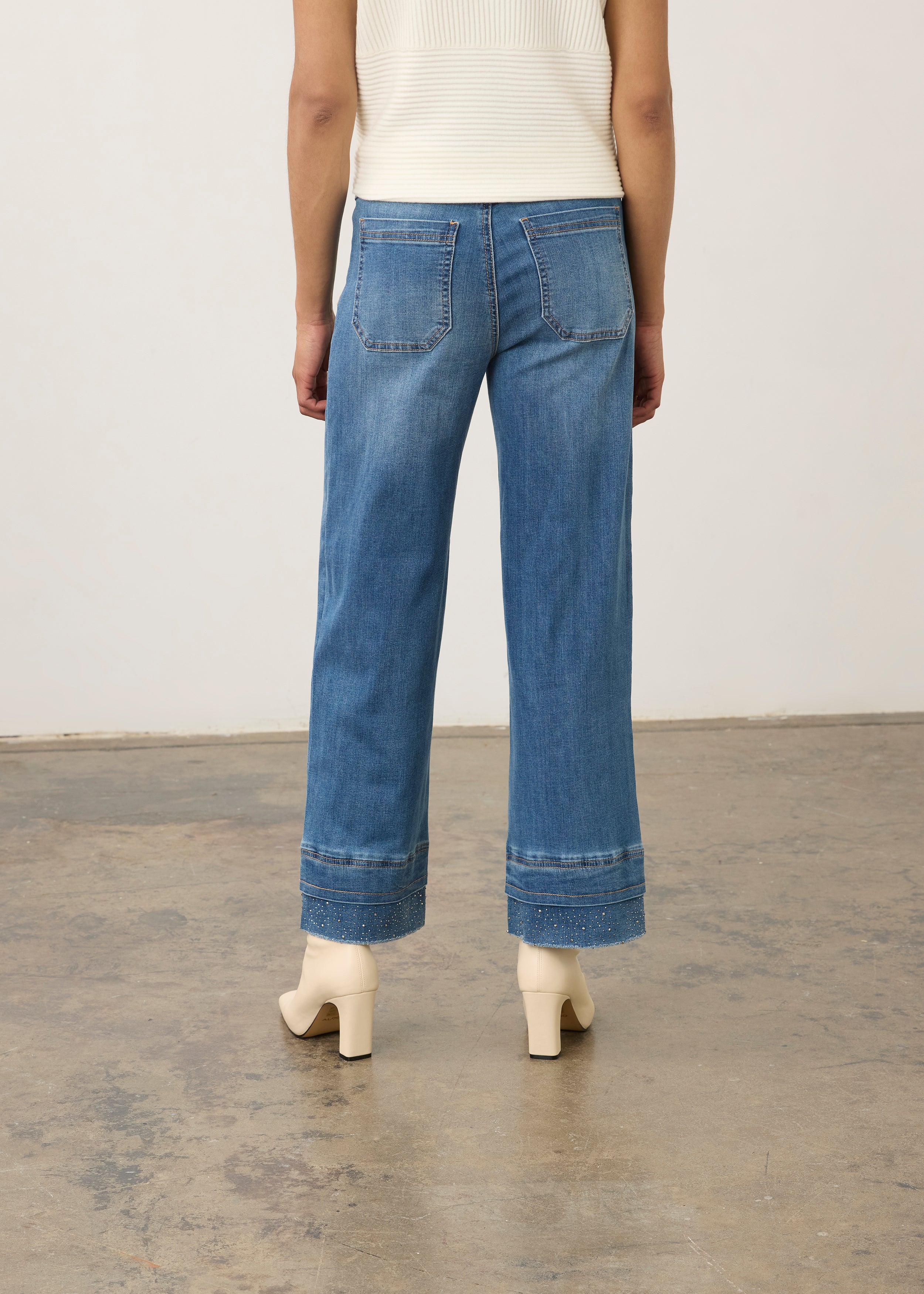 Back view of medium blue pull-on wide ankle denim with back patch pockets by French Dressing Jeans (FDJ) par French Dressing Jeans (FDJ)