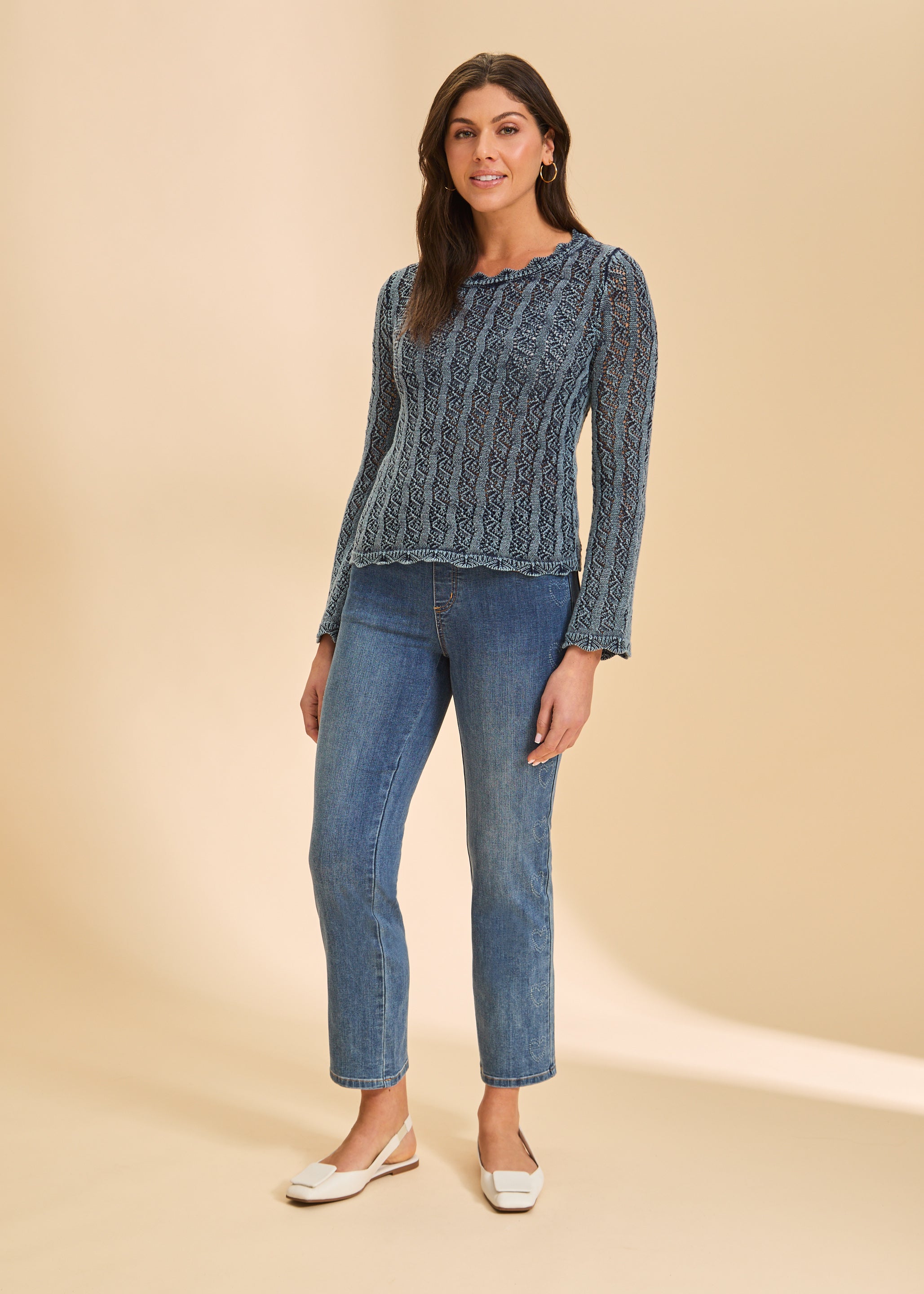 Model wearing indigo straight leg jeans with heart detail by French Dressing Jeans (FDJ)