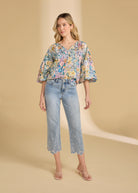 Full body view of Ambush Floral blouse paired with jeans, showing casual style by French Dressing Jeans (FDJ)
