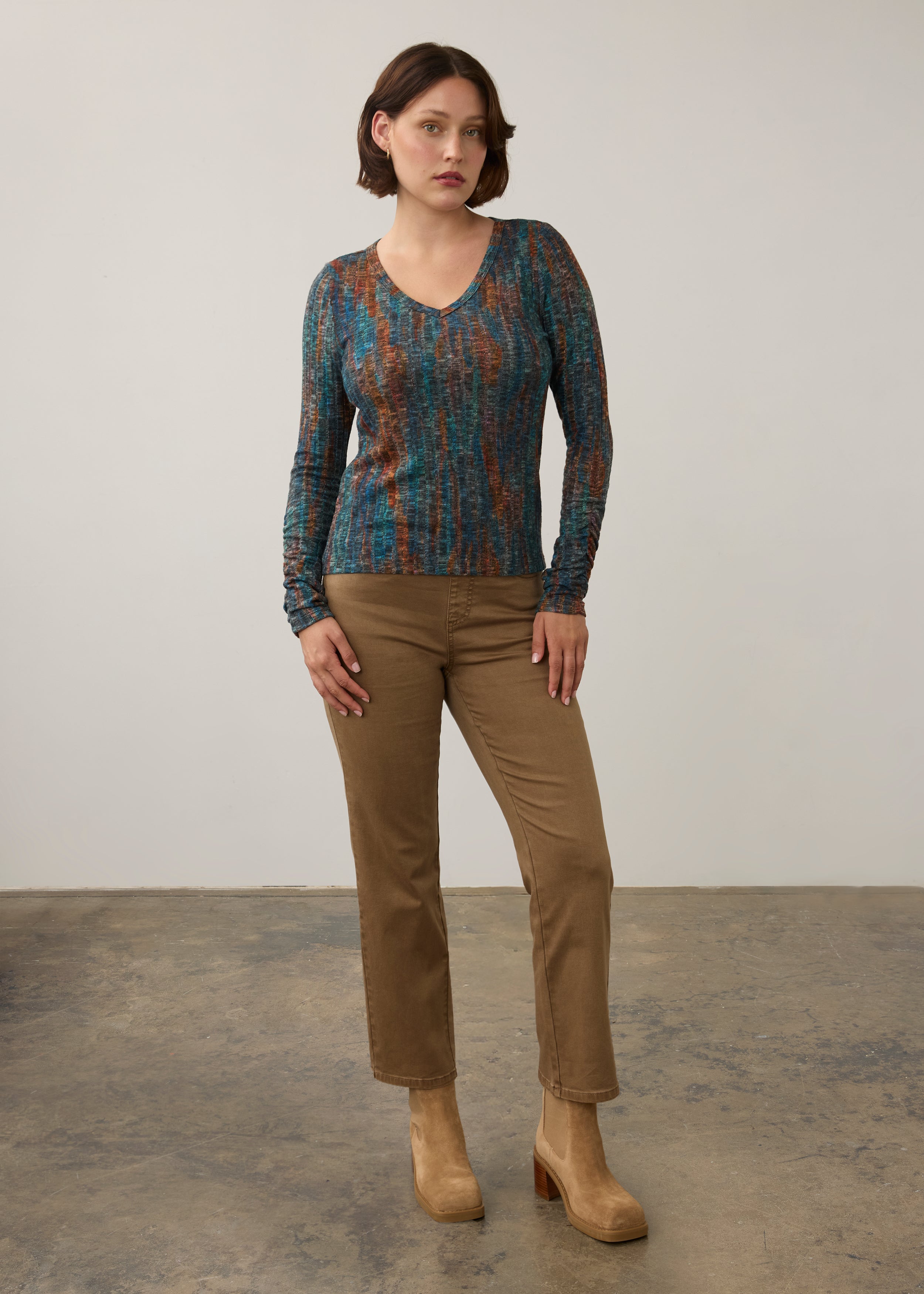 Full body view of striped V-neck top with beige pants, casual style by French Dressing Jeans (FDJ)