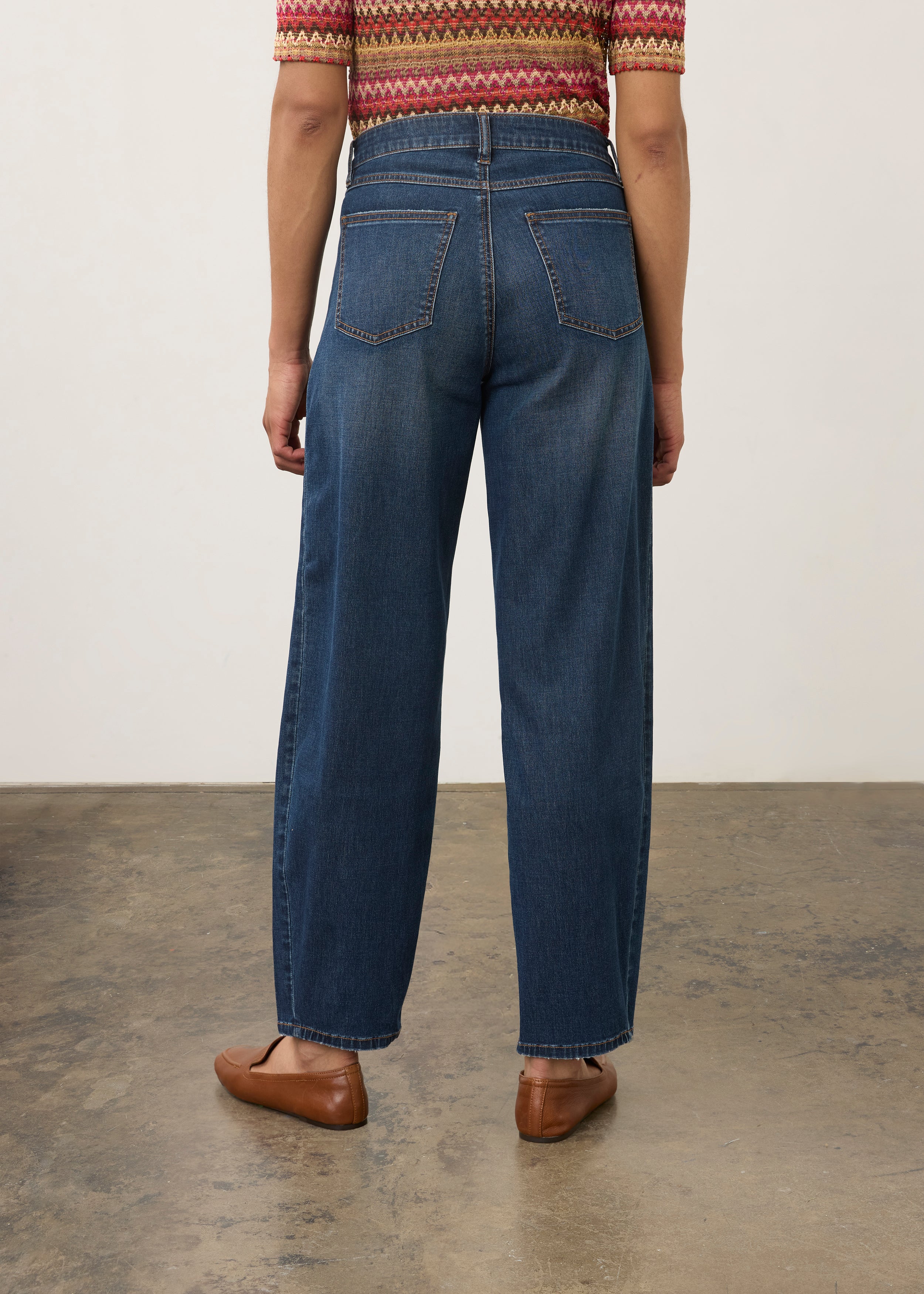 Back view of dark wash jeans with knit top, featuring back patch pockets by French Dressing Jeans (FDJ) par French Dressing Jeans (FDJ)