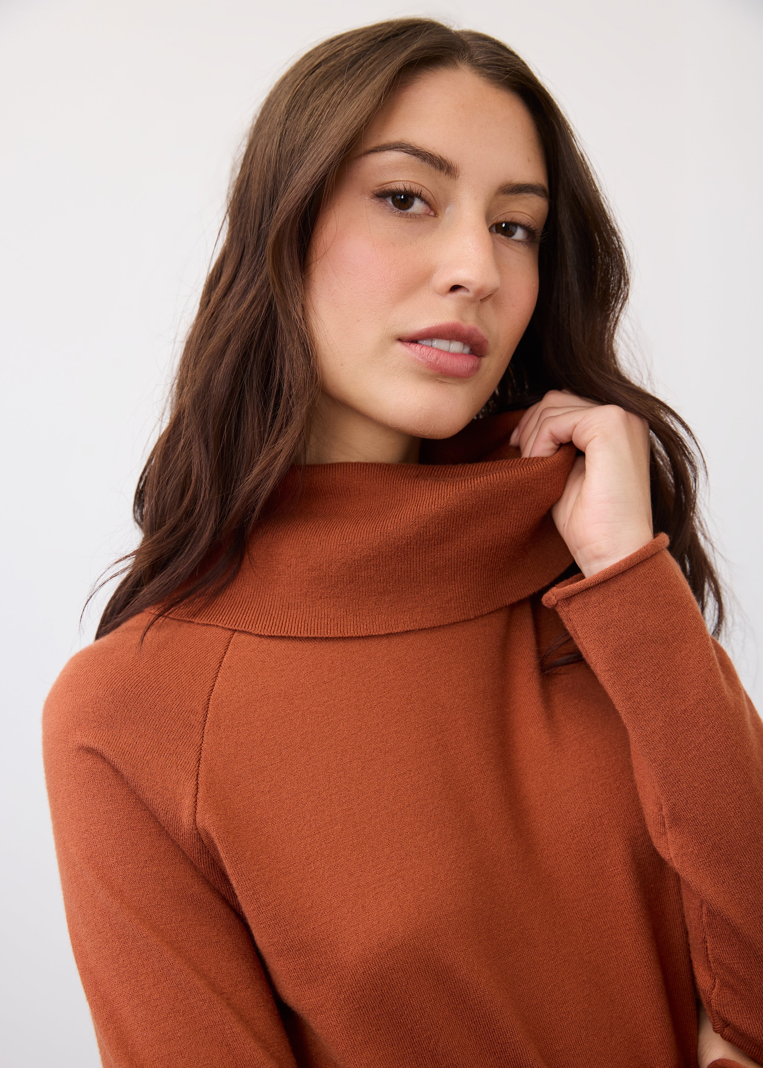 Close-up of cowl neck detail on rust sweater by French Dressing Jeans (FDJ)