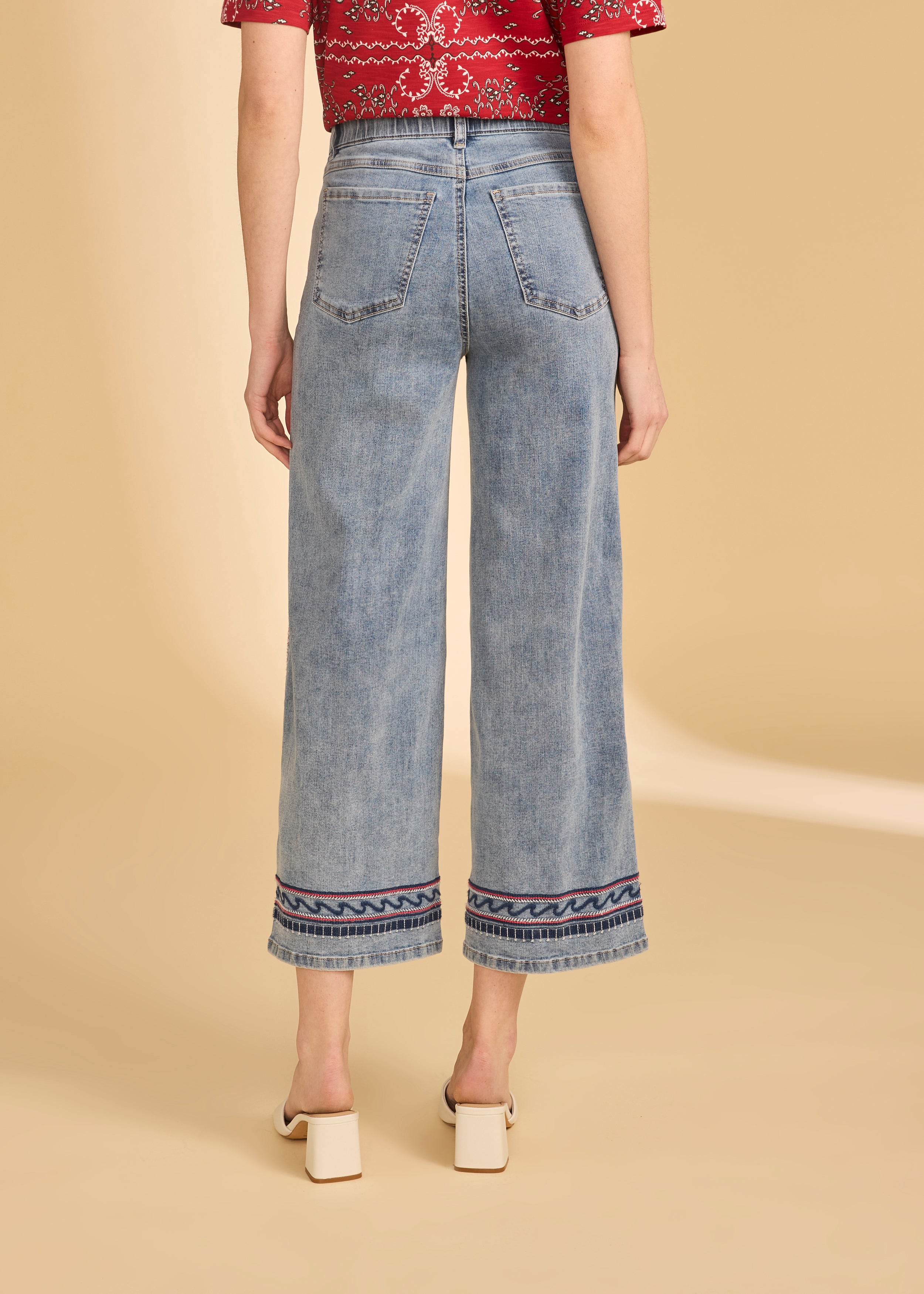 Back view of light medium denim showing embroidered hem and patch pockets by French Dressing Jeans (FDJ)