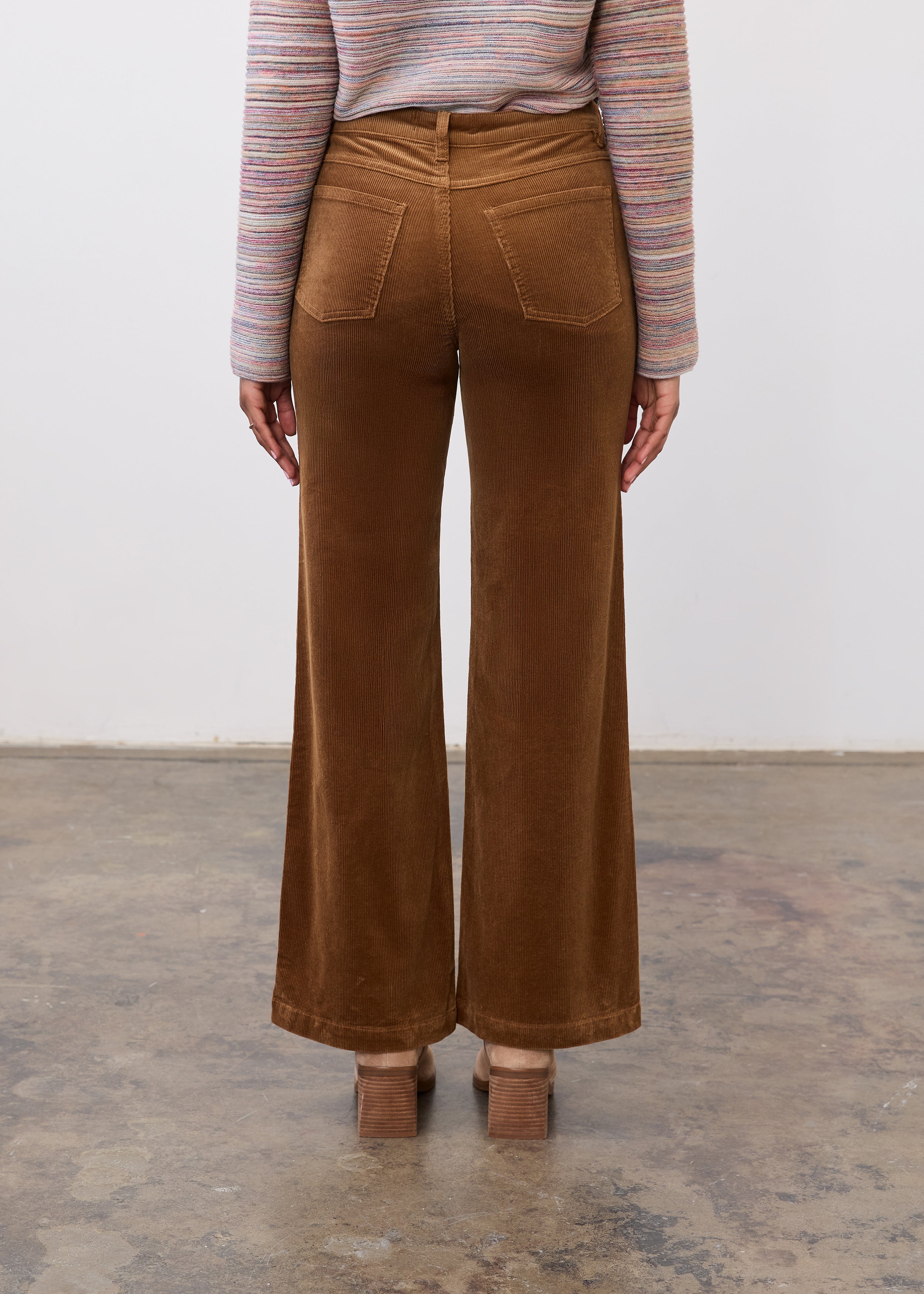 Back view of camel wide leg pants highlighting structured design and patch pockets by French Dressing Jeans (FDJ)