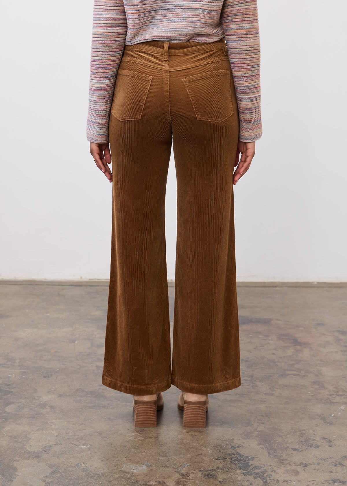 Back view of camel wide leg pants highlighting structured design and patch pockets by French Dressing Jeans (FDJ)
