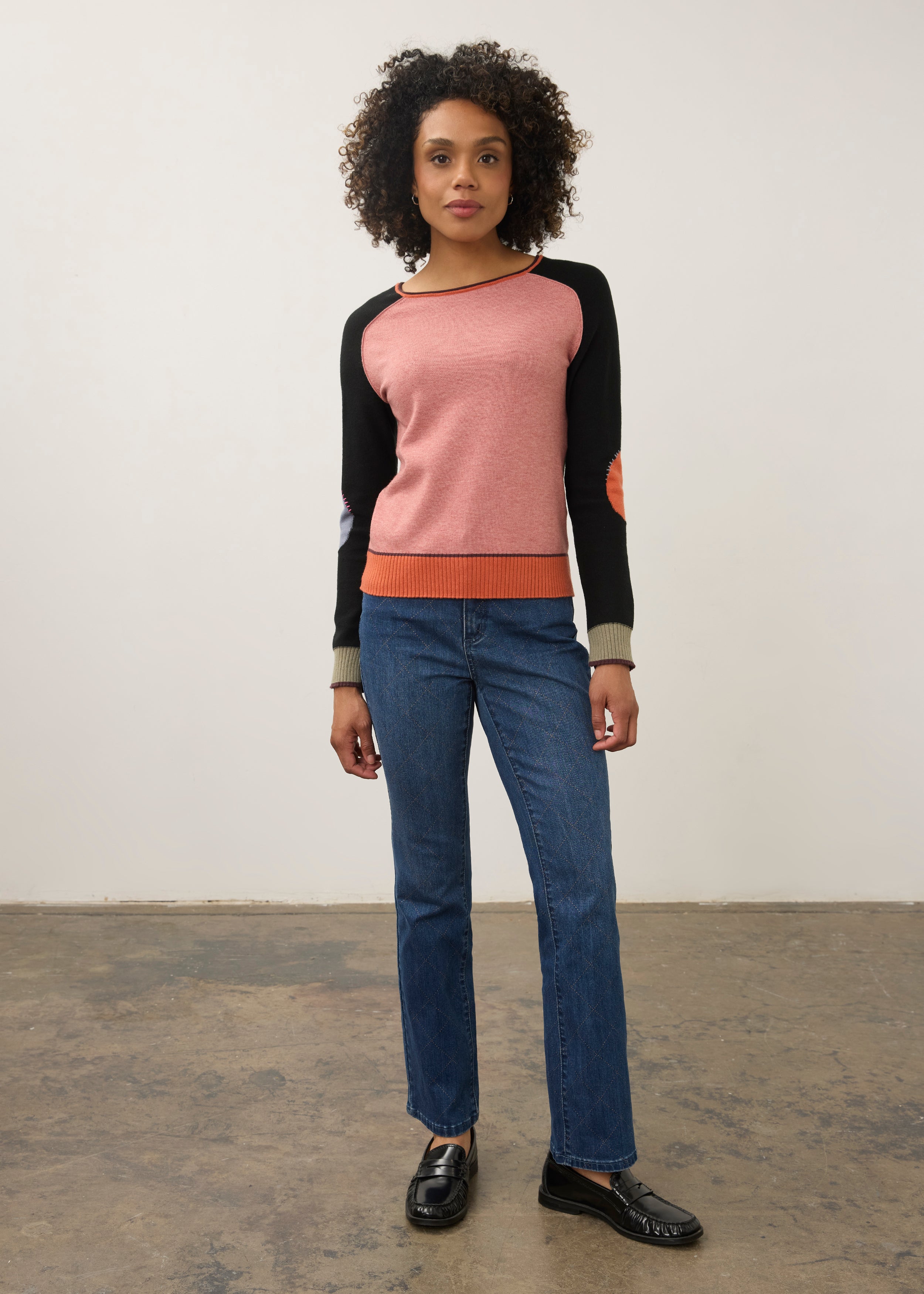 Model in pink and black colorblock sweater with jeans, full outfit view by French Dressing Jeans (FDJ)