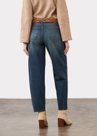 Back view of medium blue jeans highlighting patch pockets and straight leg cut by French Dressing Jeans (FDJ)