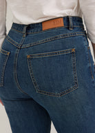 Detail shot of back pocket stitching and FDJ label on dark wash jeans by French Dressing Jeans (FDJ)