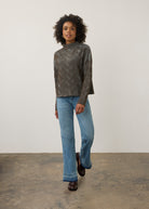 Model wearing brown textured top with jeans, full outfit view by French Dressing Jeans (FDJ)