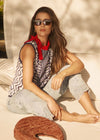 Woman wearing navy patterned sleeveless top with sunglasses by French Dressing Jeans (FDJ)