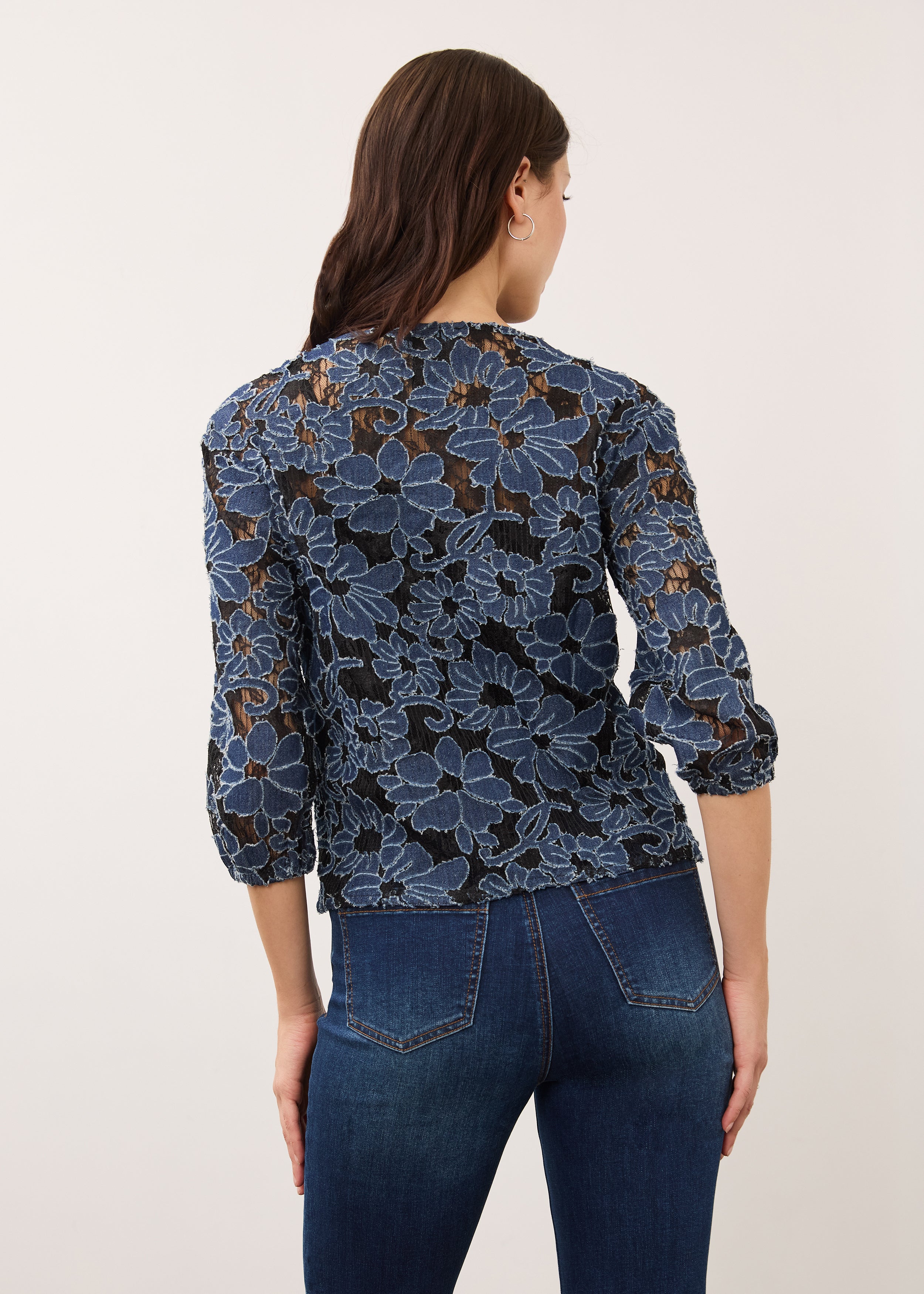 Back view of floral lace blouse showing detailed pattern and fit by French Dressing Jeans (FDJ)