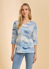 Front view of blue wave print 3/4 sleeve V-neck top with denim jeans by French Dressing Jeans (FDJ)