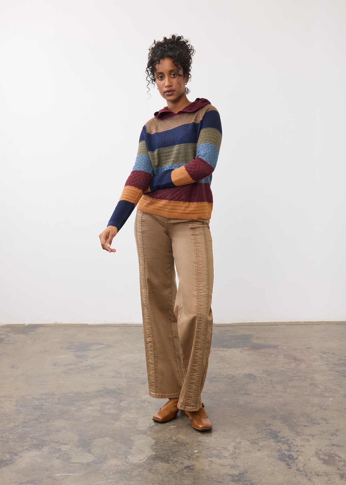 Full outfit view of striped hoodie sweater with brown pants by French Dressing Jeans (FDJ)