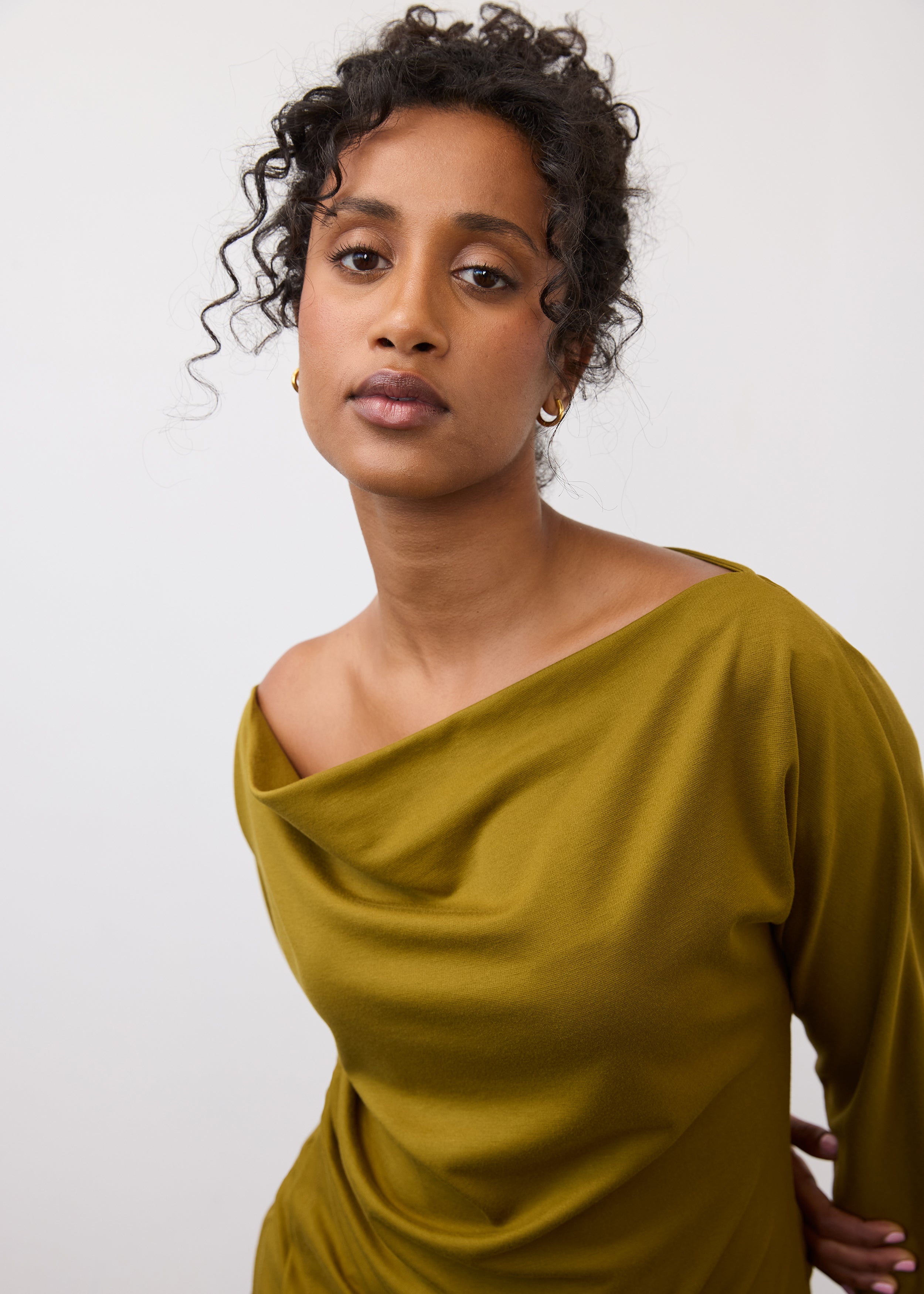 Close-up of olive green top highlighting fabric drape and neckline by French Dressing Jeans (FDJ)