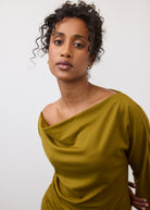 Close-up of olive green top highlighting fabric drape and neckline by French Dressing Jeans (FDJ)