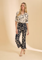 Front view of black plumeria boot crop pants with high-rise fit by French Dressing Jeans (FDJ)