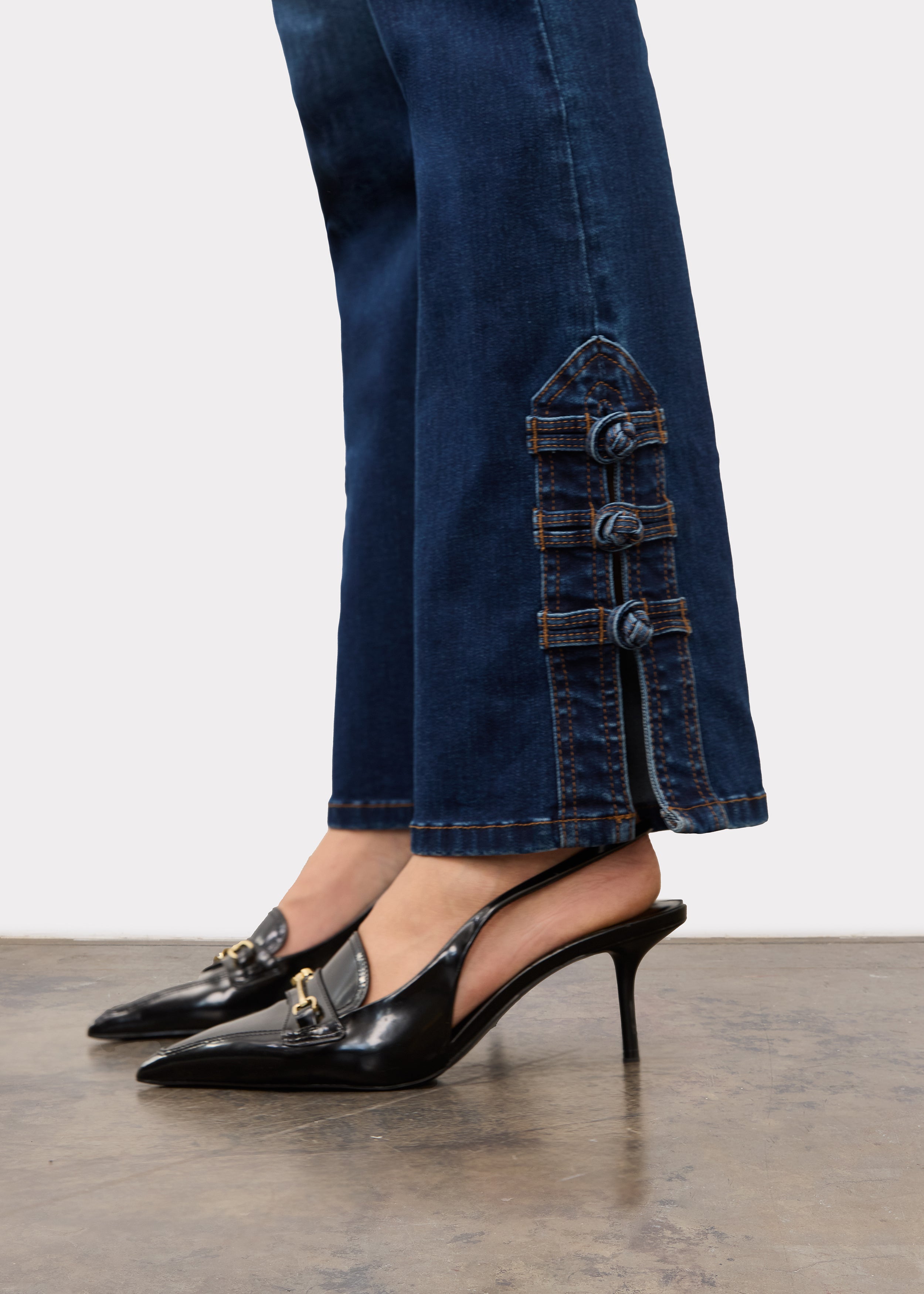 Close-up of button detailing on dark blue straight ankle denim by French Dressing Jeans (FDJ)