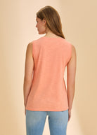 Back view of coral sleeveless top displaying simple design and lightweight fabric by French Dressing Jeans (FDJ)