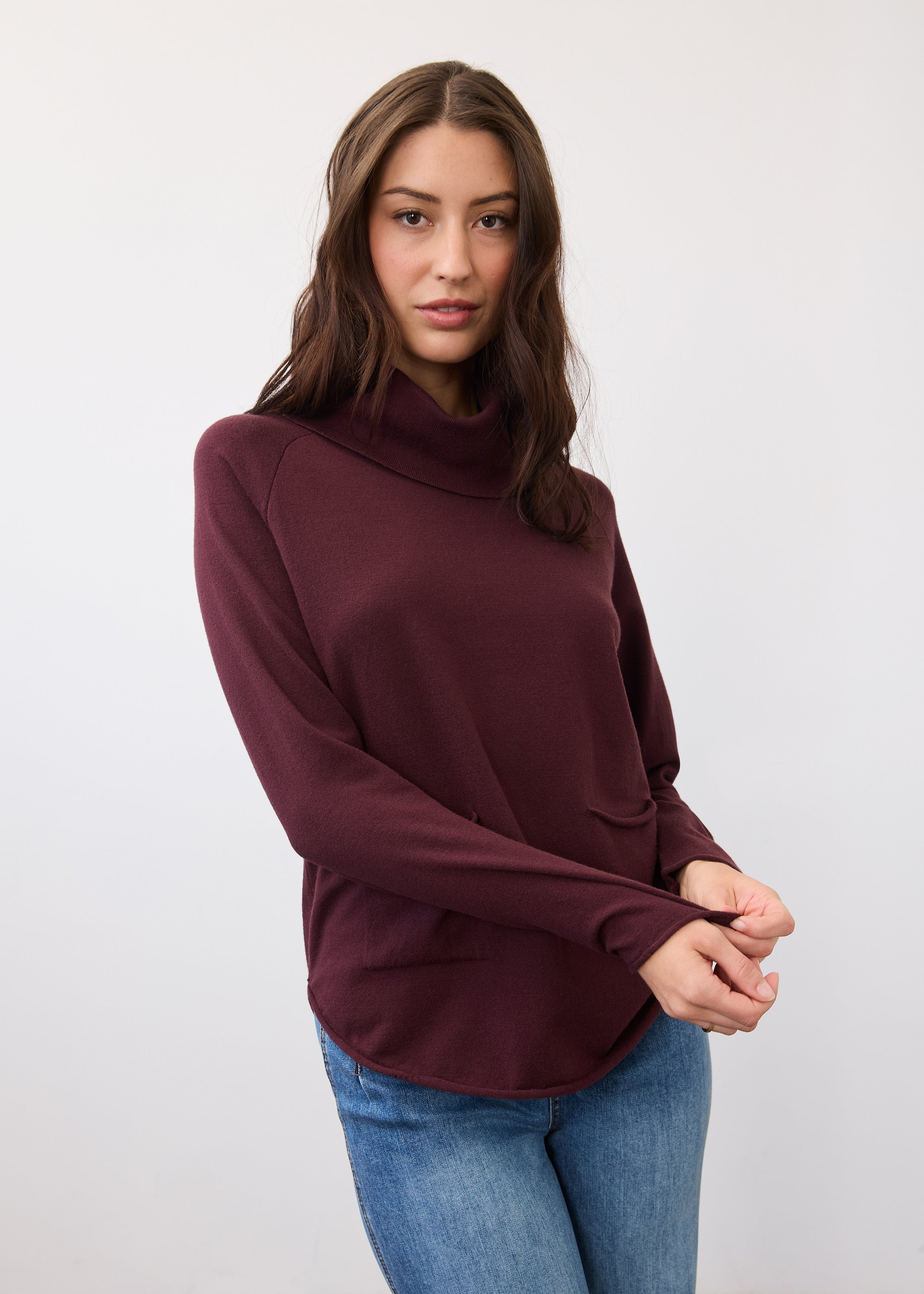 Front view of burgundy sweater with cowl neck and front pockets by French Dressing Jeans (FDJ)