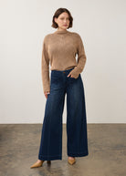 Dark rinse wide-leg jeans styled with knit sweater in full outfit view by French Dressing Jeans (FDJ)