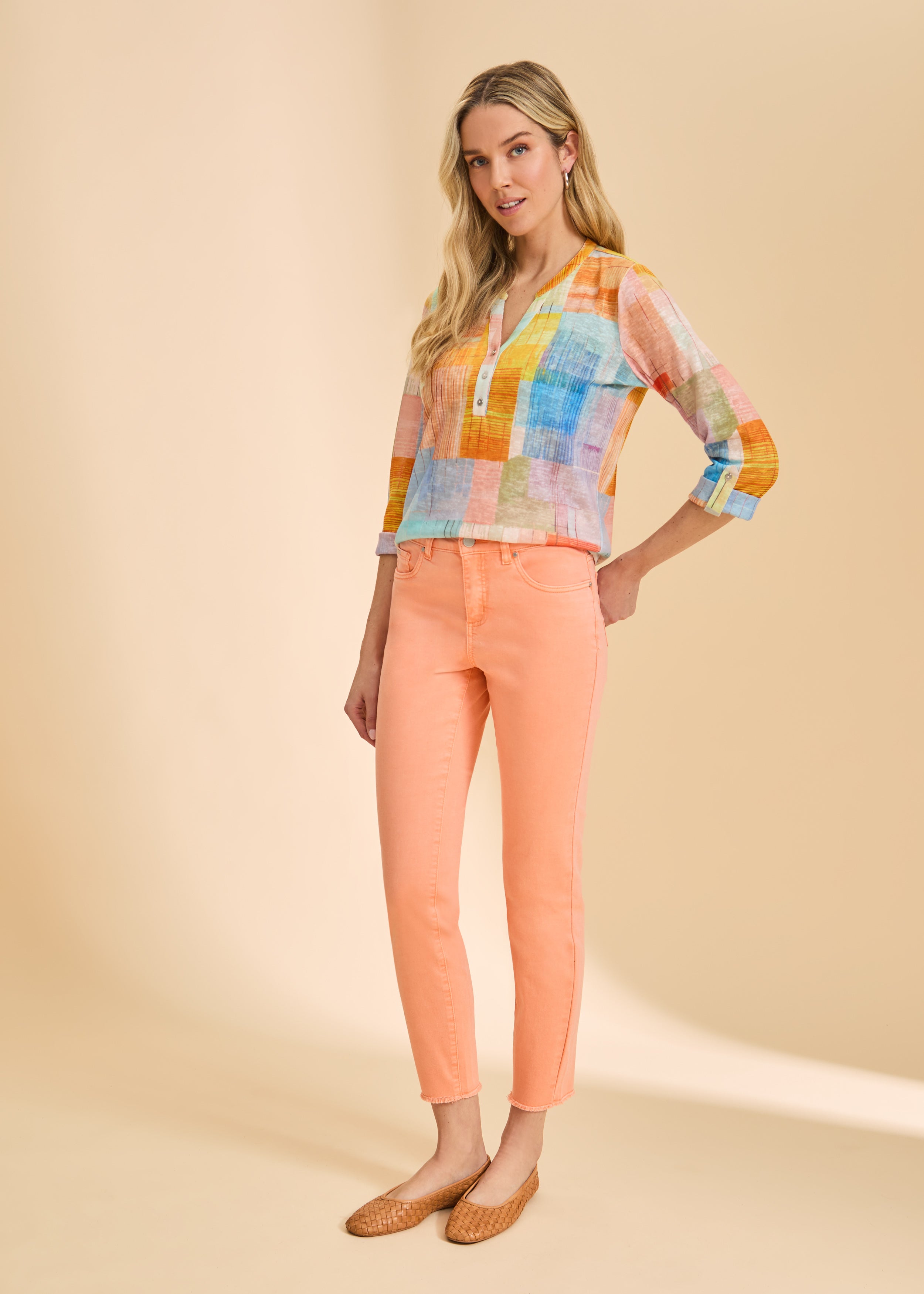 Full-length view of pastel patchwork top with orange jeans by French Dressing Jeans (FDJ)