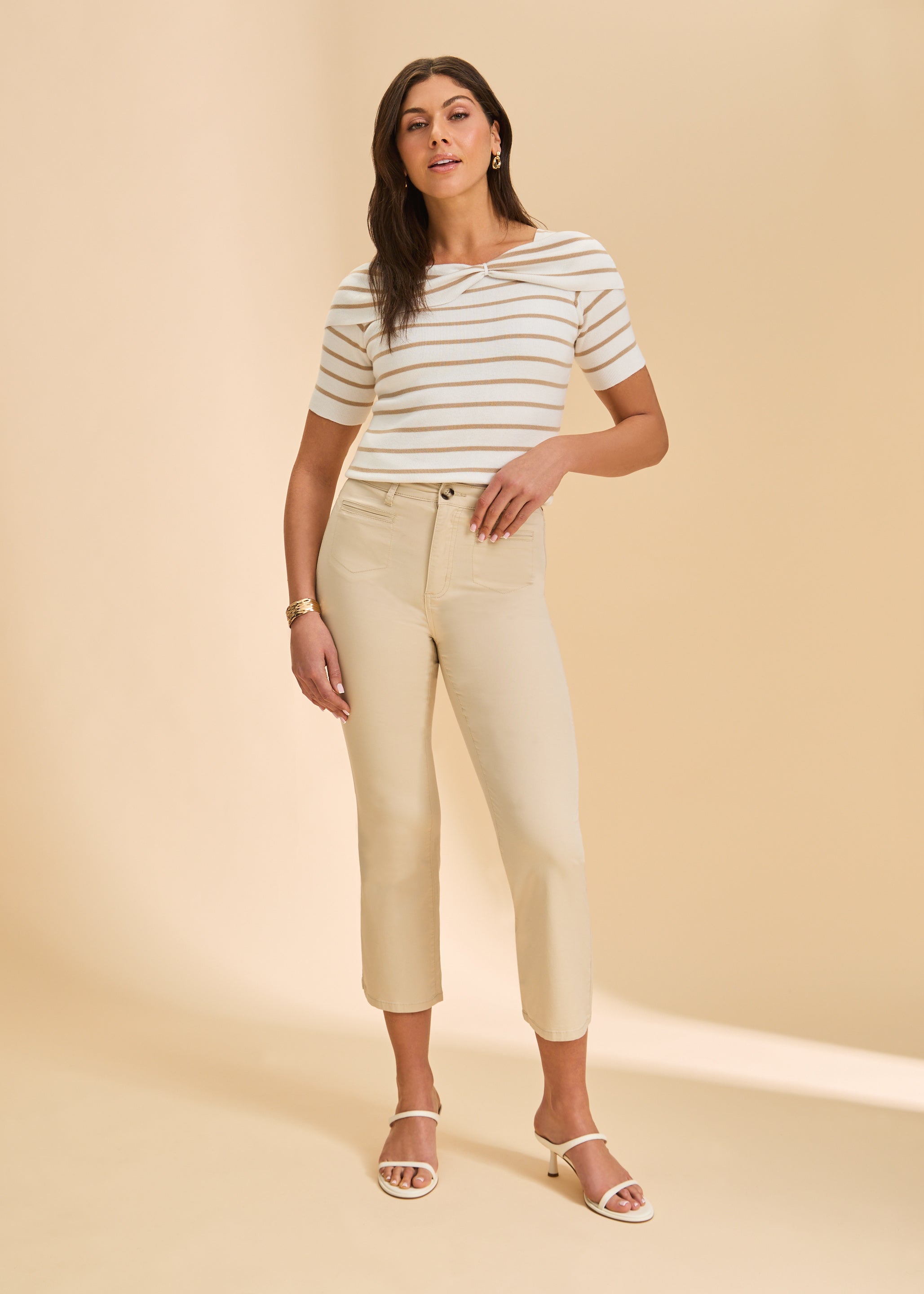 Front view of cream pants with high-rise waist and fitted crop leg by French Dressing Jeans (FDJ)