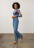 Full body view of medium wash denim pants showcasing high-rise waist and stylish fit by French Dressing Jeans (FDJ) par French Dressing Jeans (FDJ)