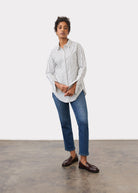 Full view of black striped shirt styled with jeans in casual setting by French Dressing Jeans (FDJ)