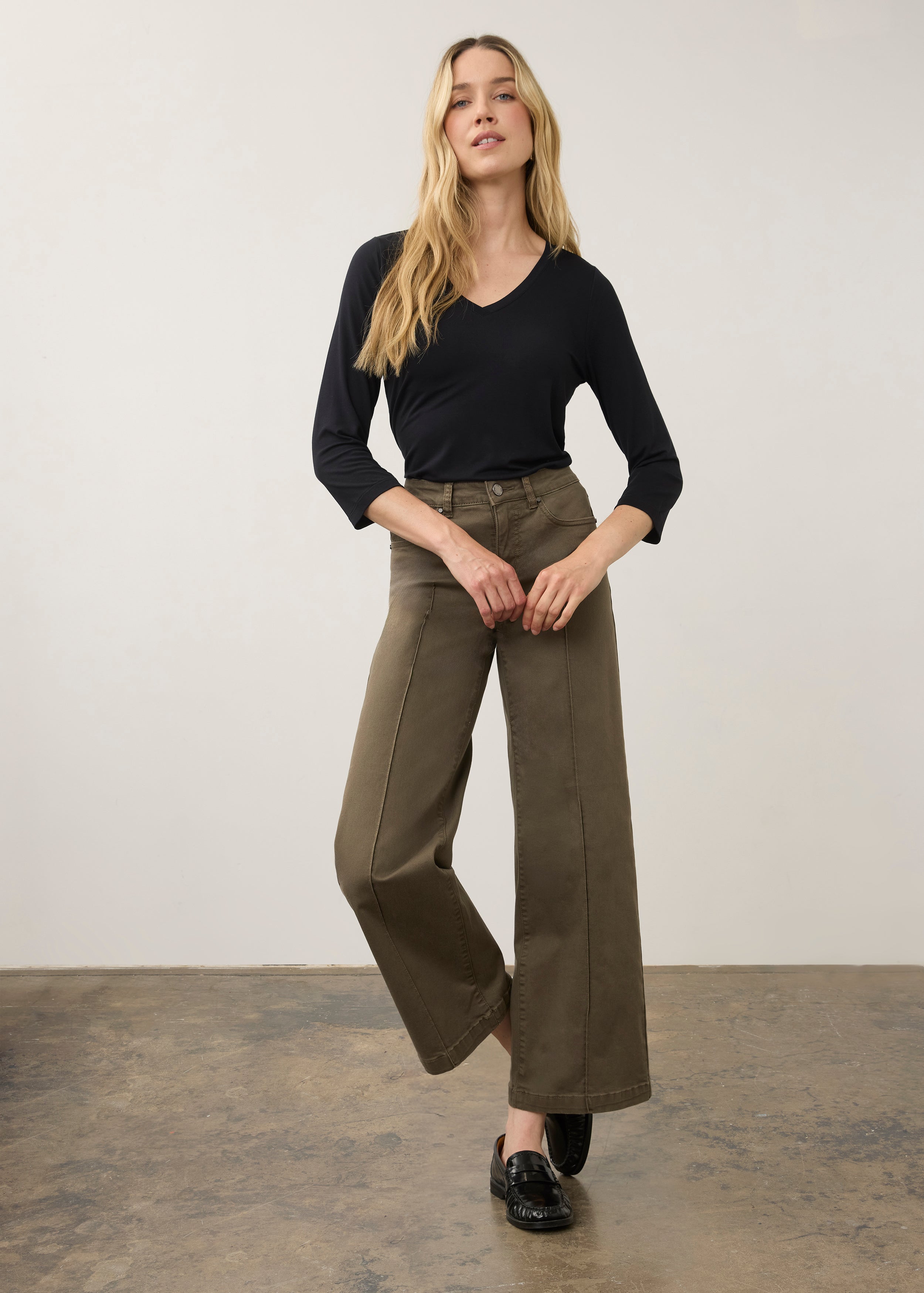 Full body view of black V-neck top paired with wide-leg pants by French Dressing Jeans (FDJ)