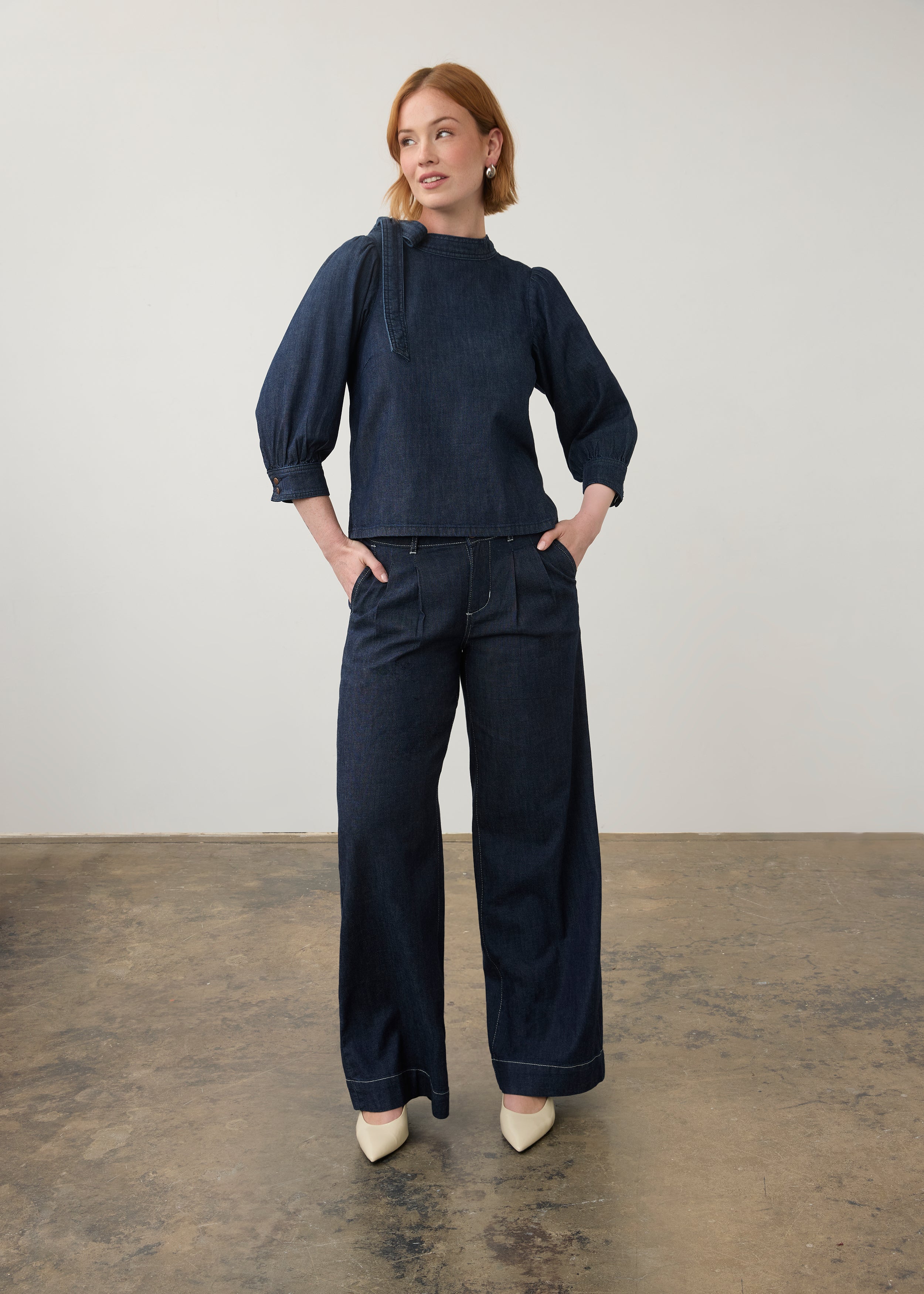 Full view of dark wash denim set with puff-sleeve top and wide-leg pants by French Dressing Jeans (FDJ)