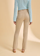 Back view of sand straight-leg jeans, highlighting classic pocket design by French Dressing Jeans (FDJ)