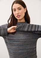 Close-up of multicolored striped sweater focusing on texture by French Dressing Jeans (FDJ)