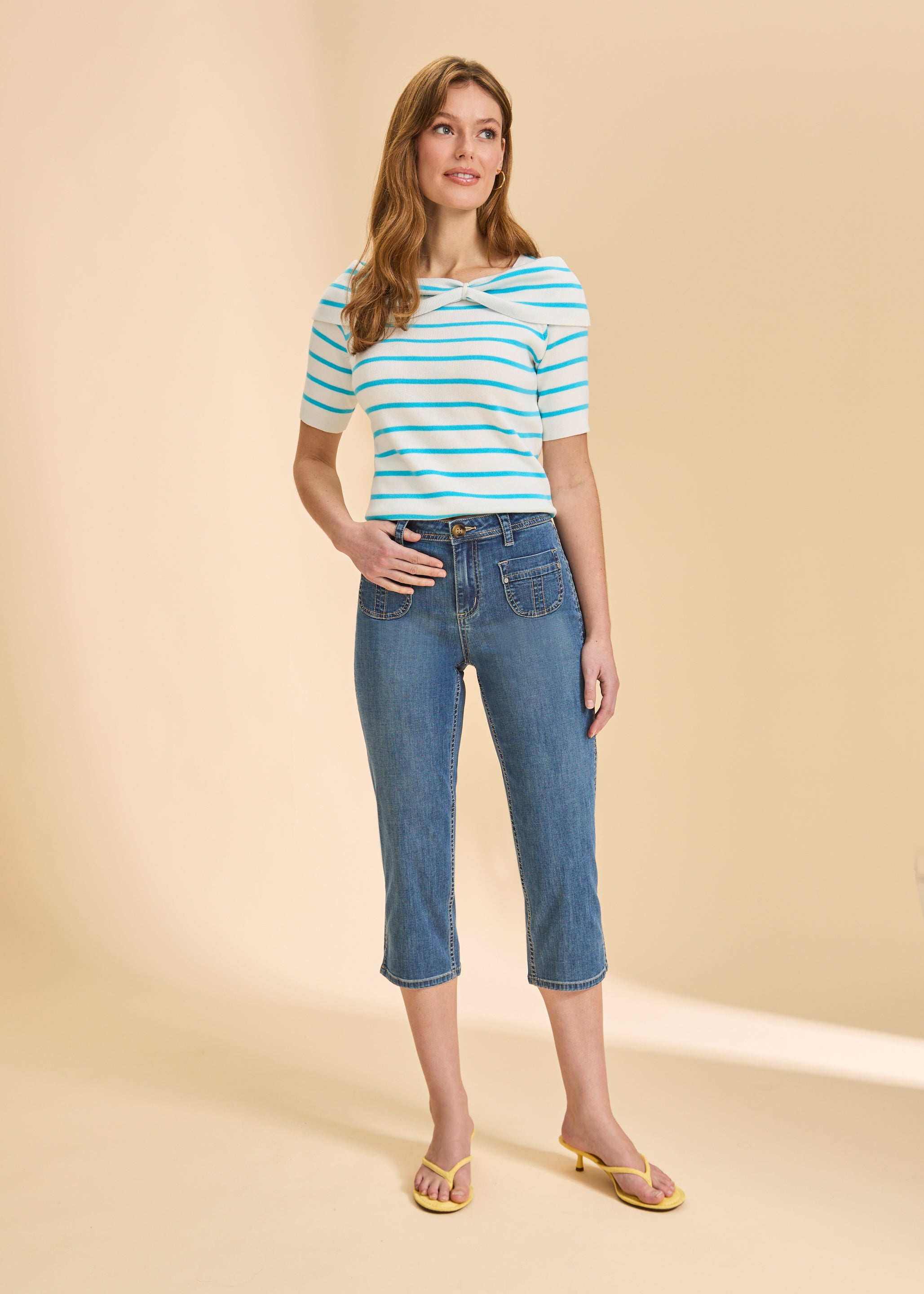 Front view of medium wash cropped jeans with patch pockets and striped top by French Dressing Jeans (FDJ)