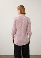 Back view of striped red and white shirt showcasing long sleeves by French Dressing Jeans (FDJ)