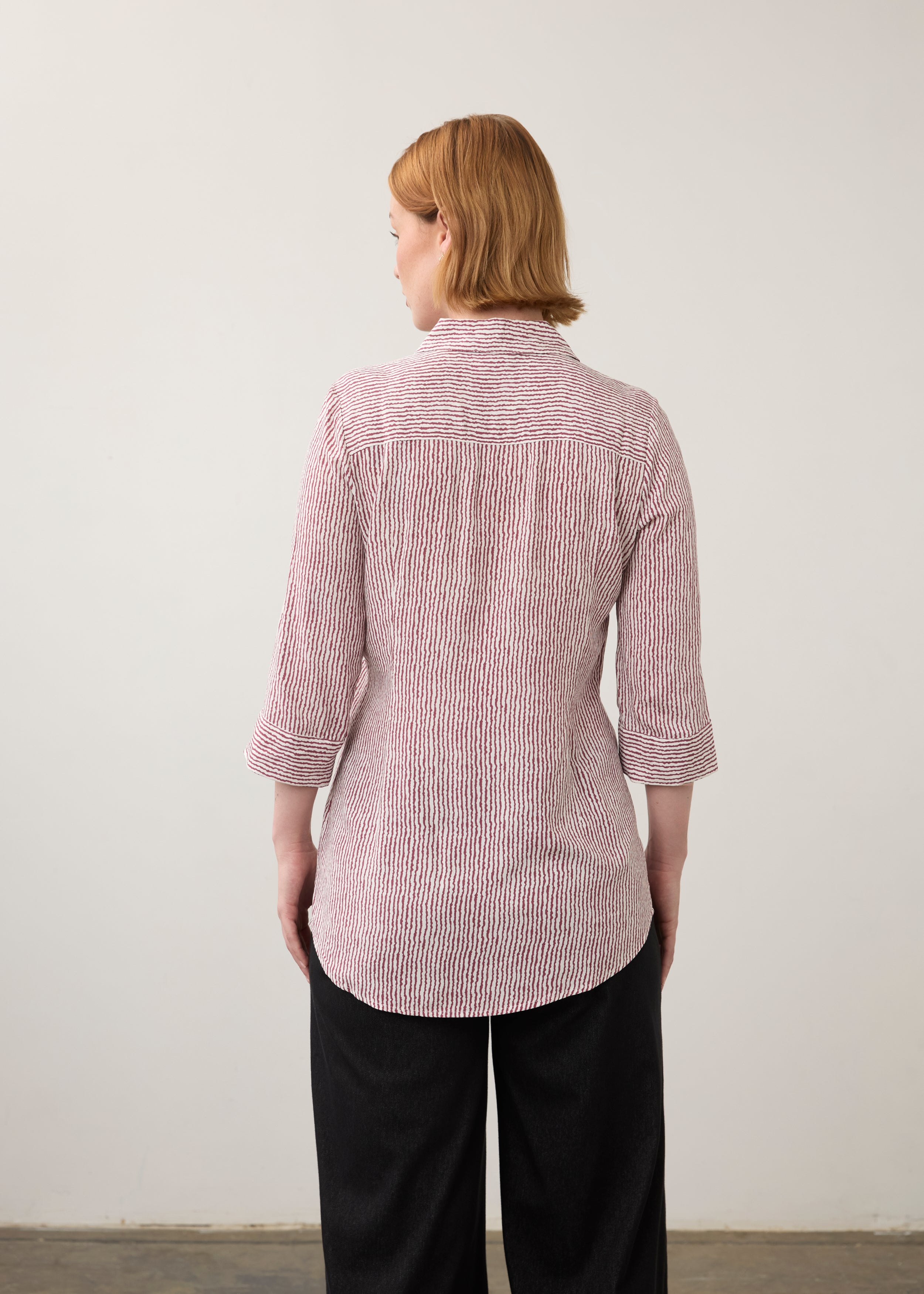 Back view of striped red and white shirt showcasing long sleeves by French Dressing Jeans (FDJ)
