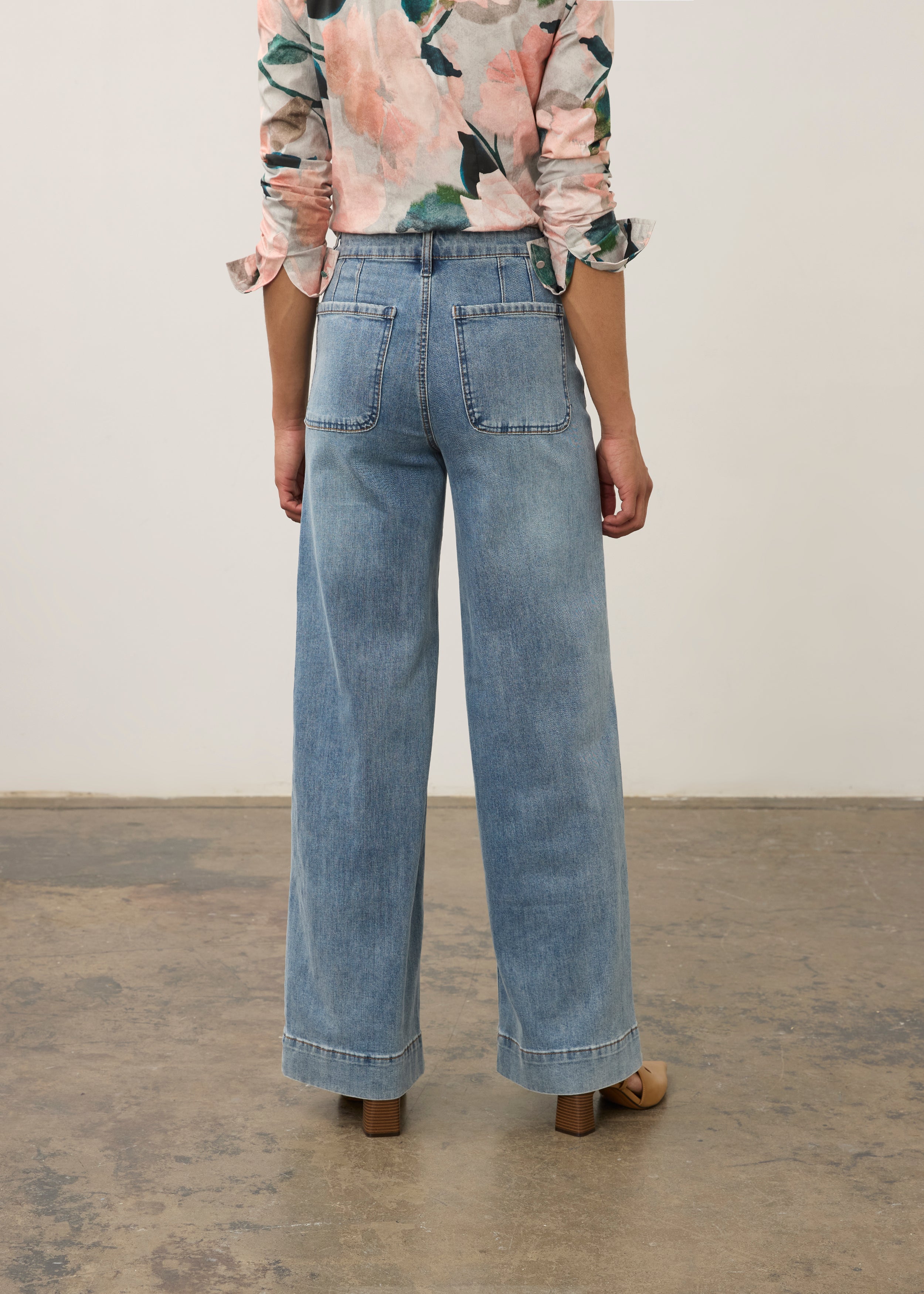 Back view of medium blue Olivia denim highlighting clean patch pockets by French Dressing Jeans (FDJ)
