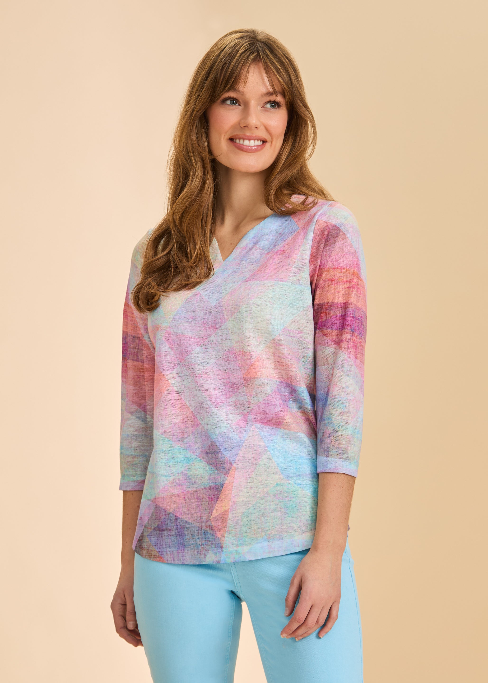 Front view showing geometric pastel design on 3/4 sleeve V-neck top by French Dressing Jeans (FDJ)