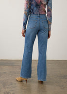 Back view of medium wash denim pants featuring back patch pockets and bootcut leg by French Dressing Jeans (FDJ) par French Dressing Jeans (FDJ)