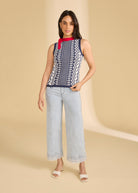 Full view of navy patterned sleeveless top styled with light jeans by French Dressing Jeans (FDJ)