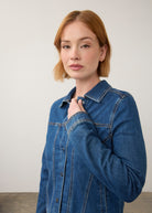 Close-up of denim jacket detailing collar and button front by French Dressing Jeans (FDJ)