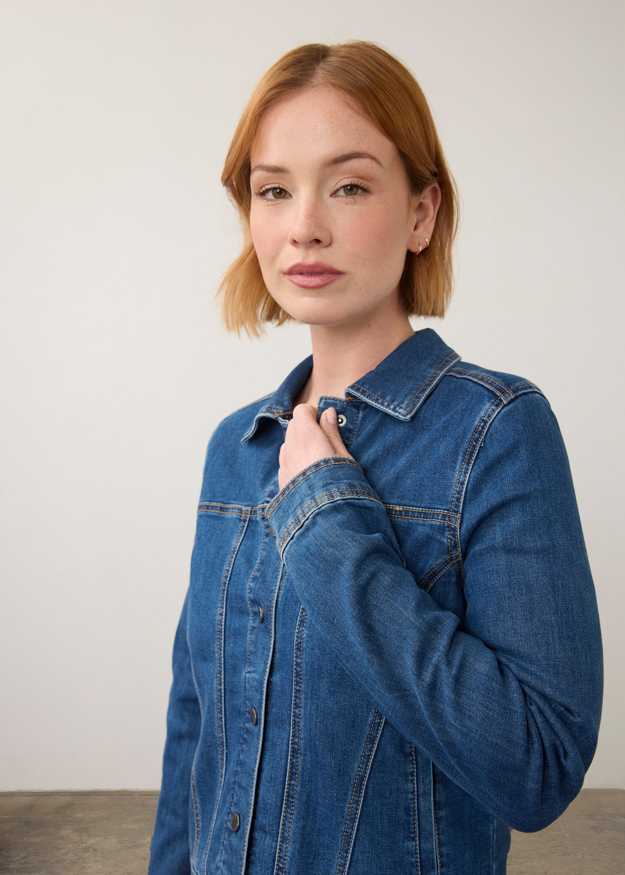 Close-up of denim jacket detailing collar and button front by French Dressing Jeans (FDJ)