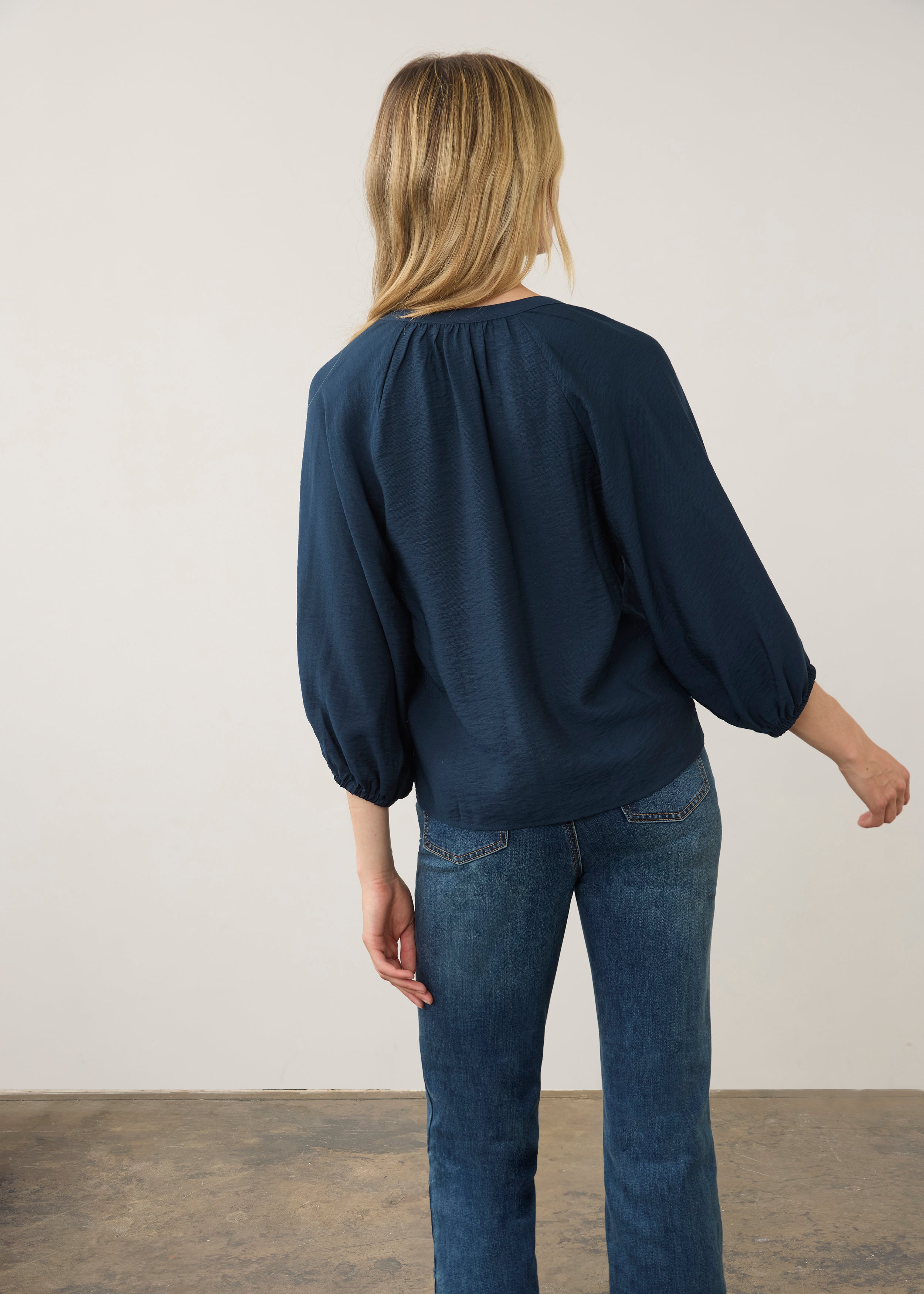 Back view of navy blouse showcasing puff sleeves by French Dressing Jeans (FDJ)