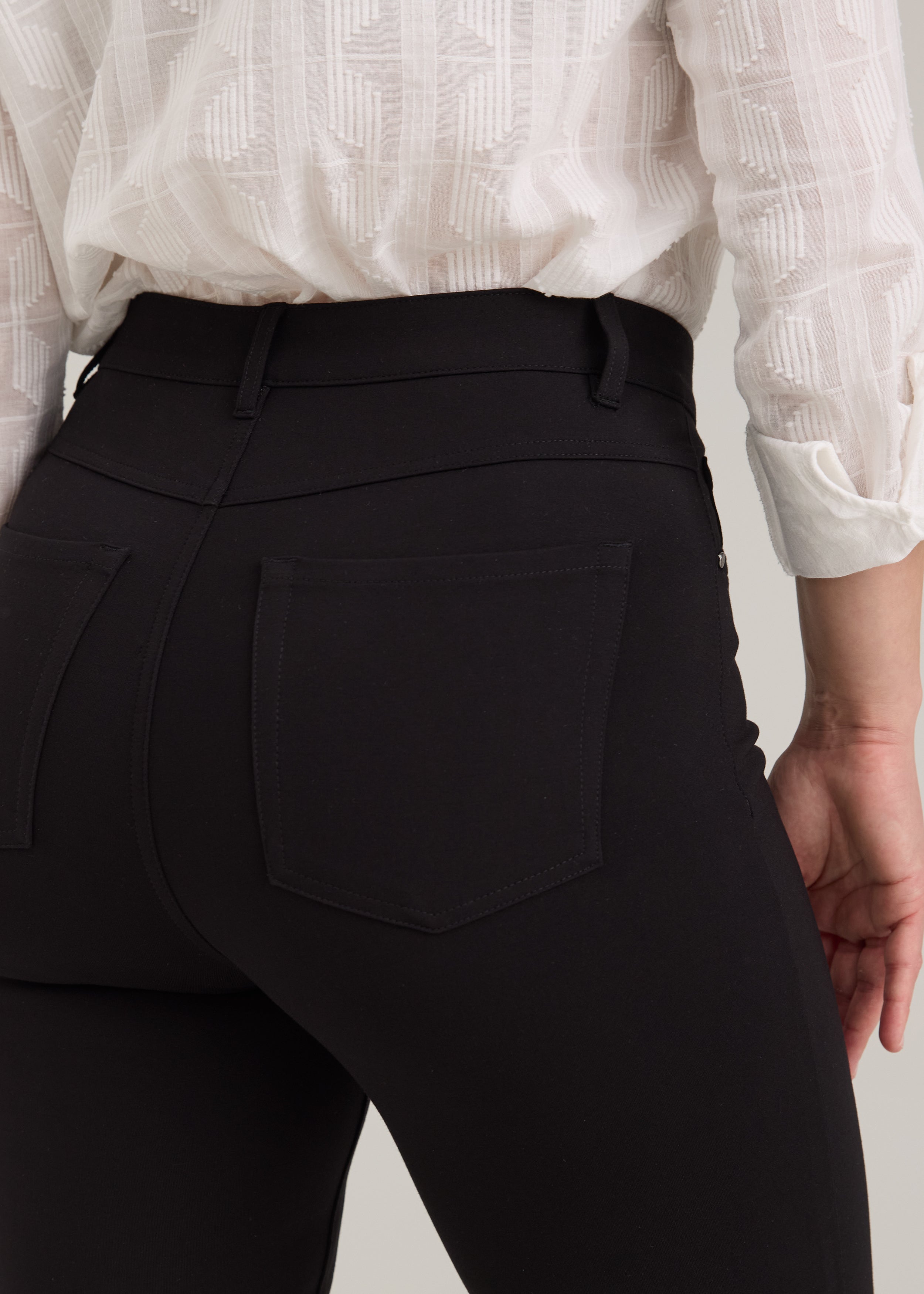 Close-up detail of black pants showing back patch pockets and stitching by French Dressing Jeans (FDJ)