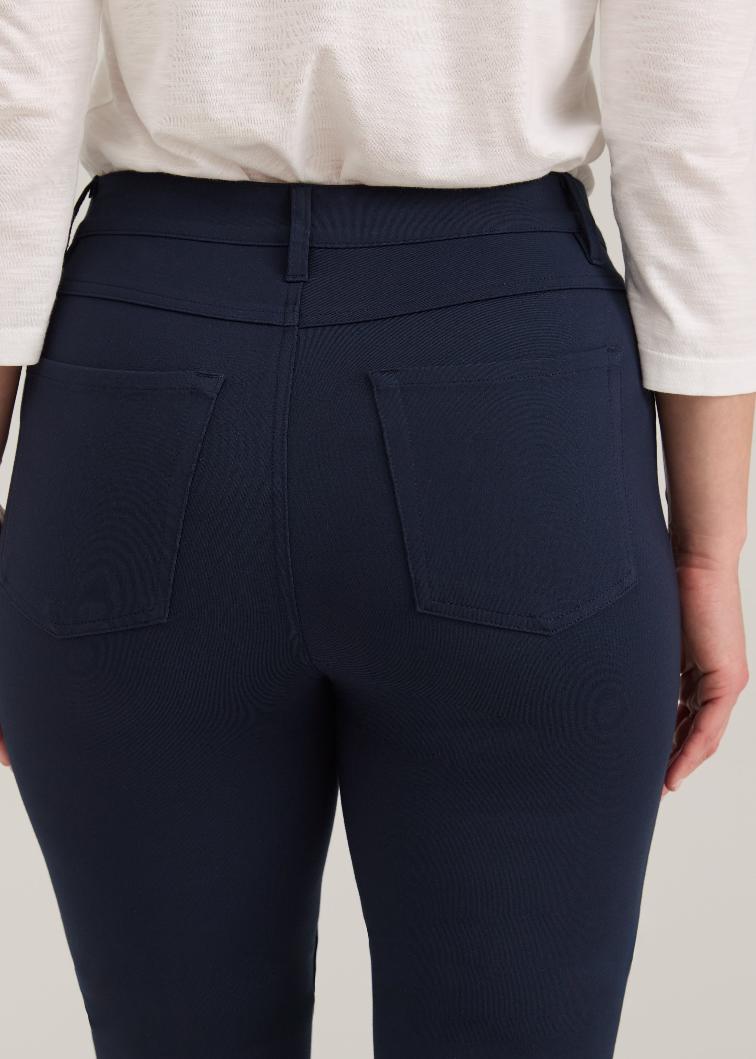 Close-up of navy pants showing back patch pockets and fabric by French Dressing Jeans (FDJ)