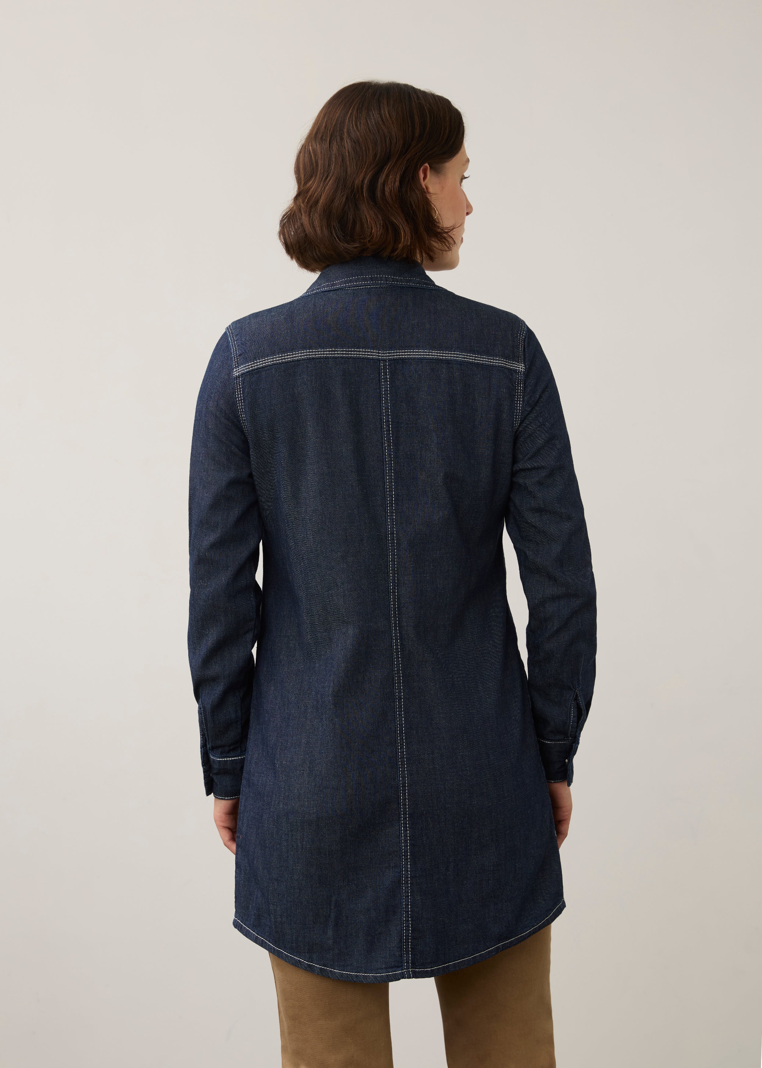 Back view of dark wash long denim tunic showing yoke and sleeve details by French Dressing Jeans (FDJ)