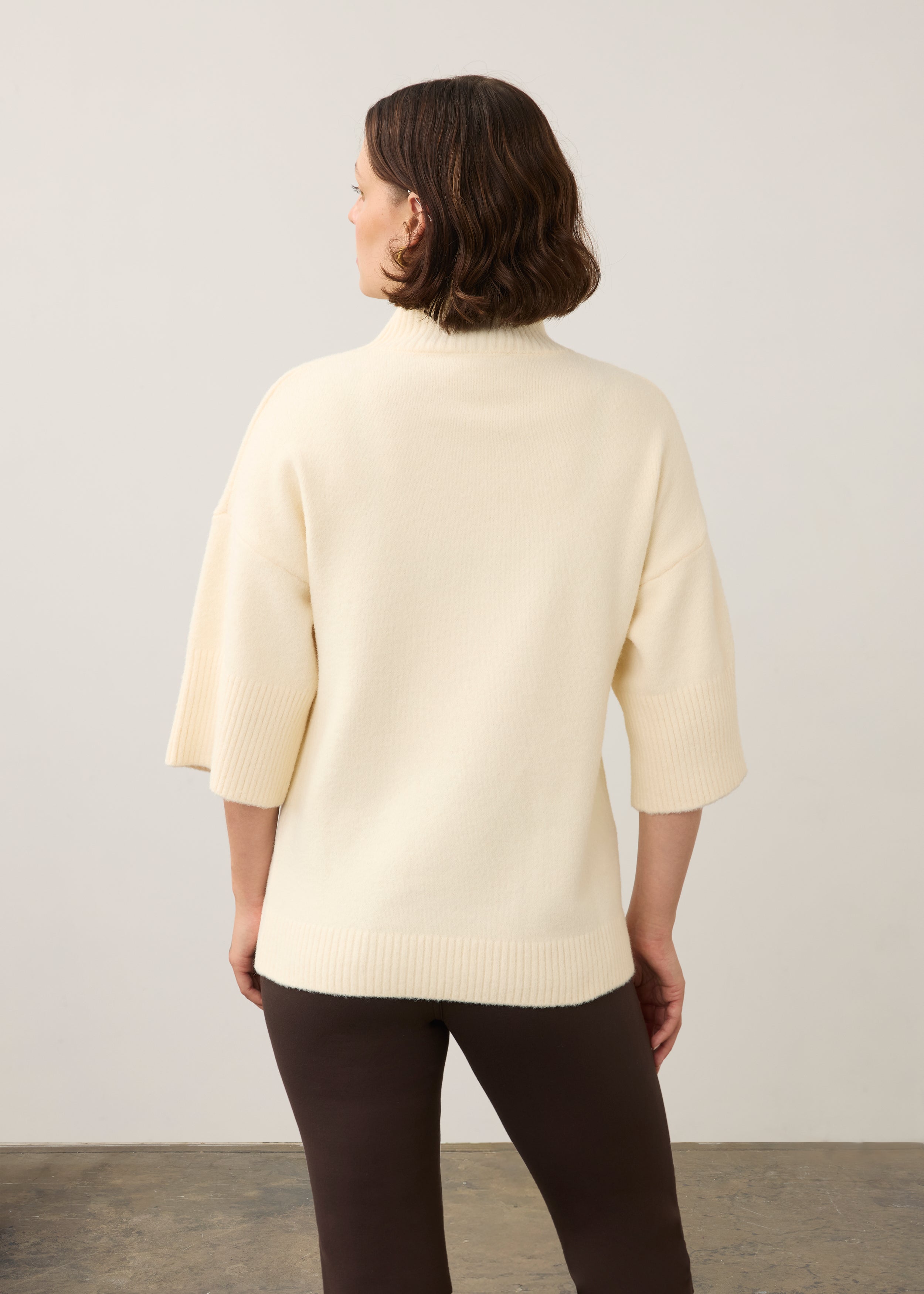 Back view of cream tunic sweater highlighting simple, elegant design by French Dressing Jeans (FDJ)