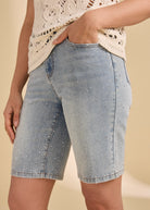 Side detail of Olivia Bermuda shorts highlighting embellishments in indigo blue by French Dressing Jeans (FDJ)